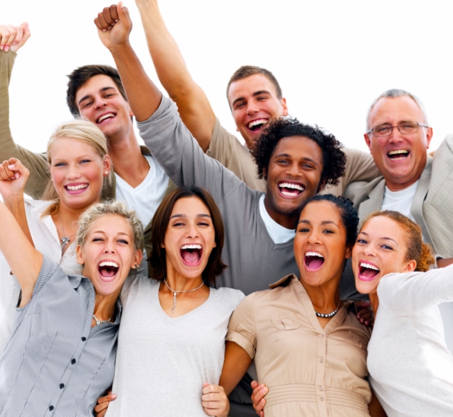 Portrait of a group of business people laughing against white background