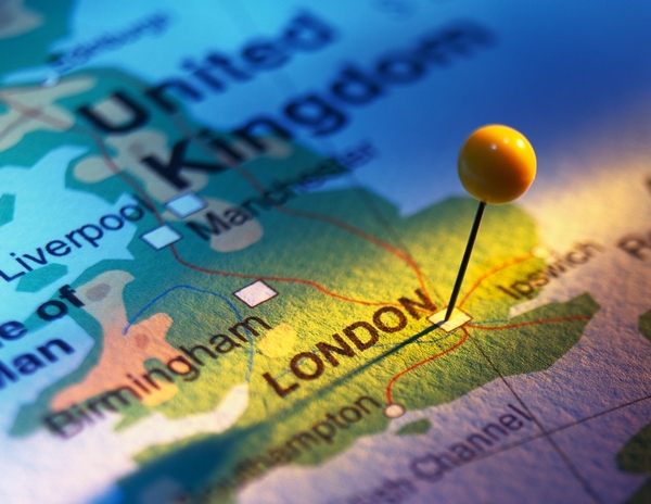 close-up of a pin tacked on a map of the united kingdom